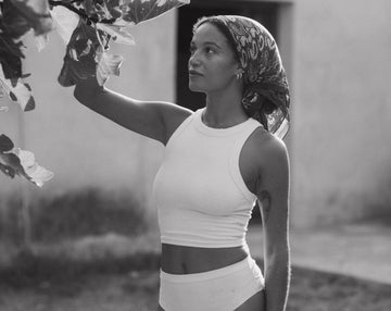 Mella Soul pausing beside a tree in Ibiza, practising mindful attention